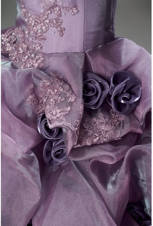 Purple dusty mauve strapless ball gown with lace up corset back and cascading ruffles