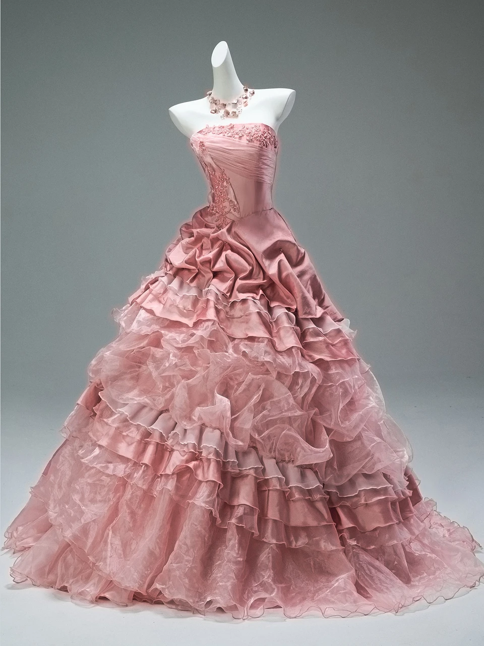 Pink tiered ball gown with strapless embroidered bodice and full tulle skirt