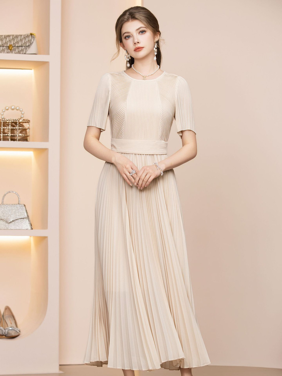 Apricot chiffon tea length mother of the bride dress with pleated detail