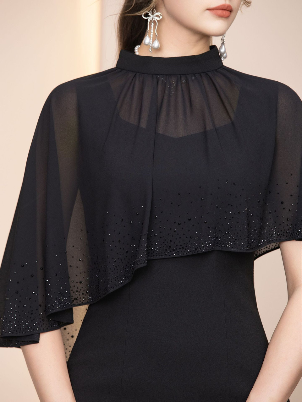 Black sheer overlay mother of the bride dress with beading and high neckline