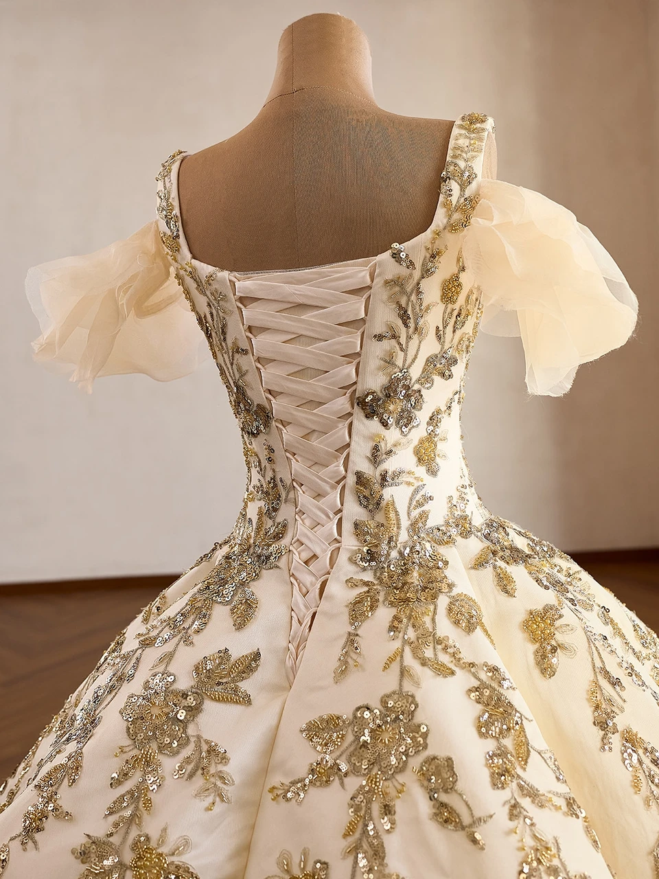 Champagne ball gown corset lace-up back with floral appliqué and beaded skirt