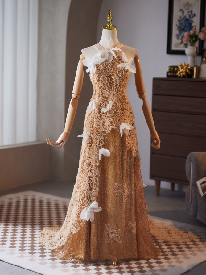Champagne lace floral prom dress with white petal trail and flowing A-line skirt