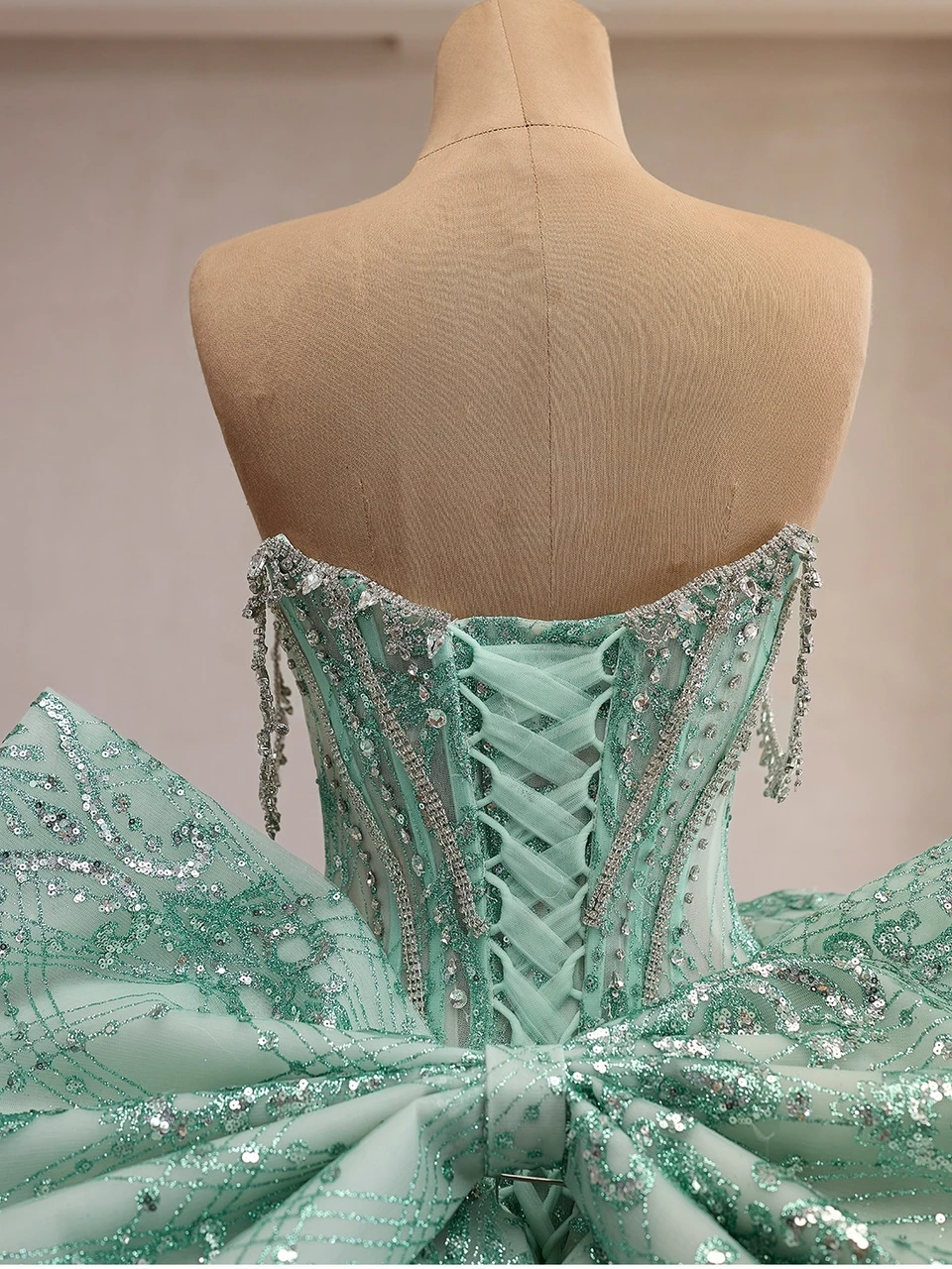 Back view of the finished mint green crystal beaded ball gown bodice