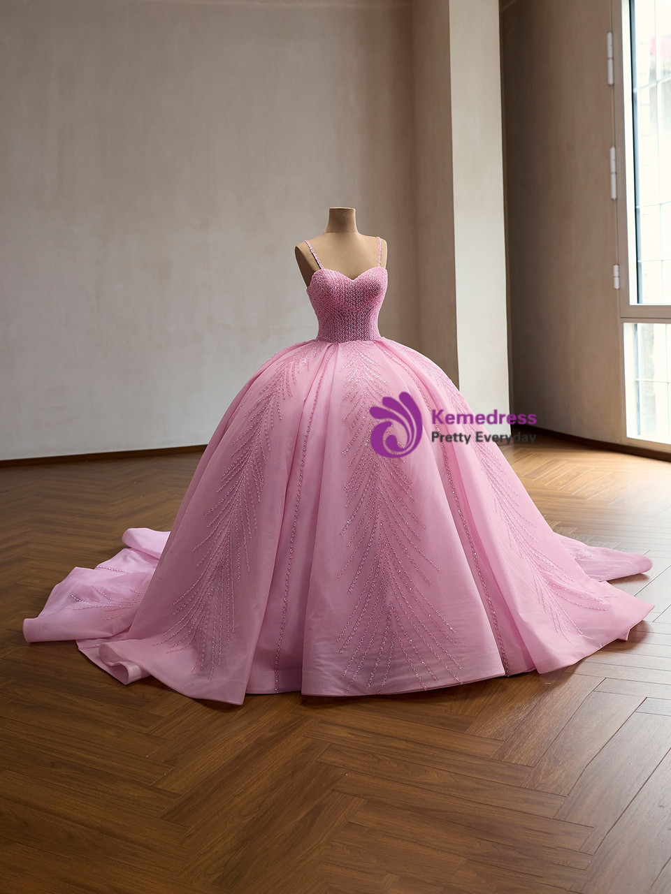 Finished pink hand beaded ball gown with full skirt and short train
