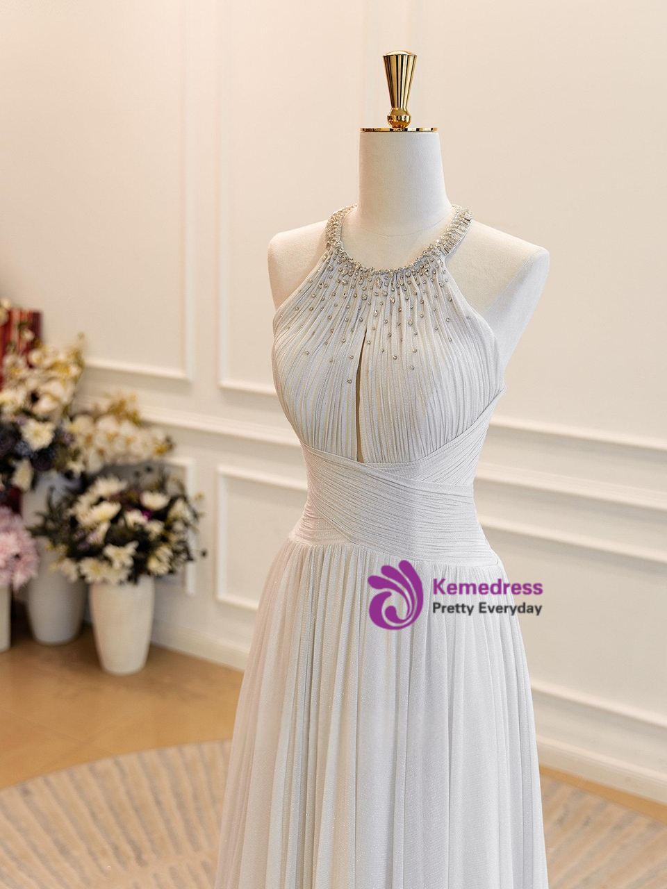 Silver halter formal gown with beaded bodice and pleated tulle skirt