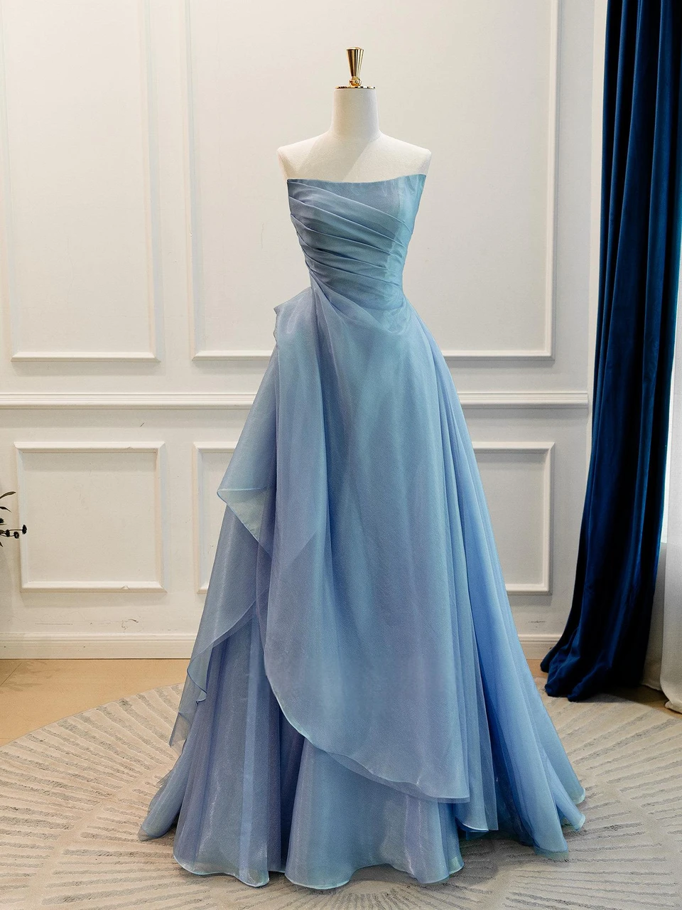 Dusty blue strapless prom dress with asymmetric draped fabric