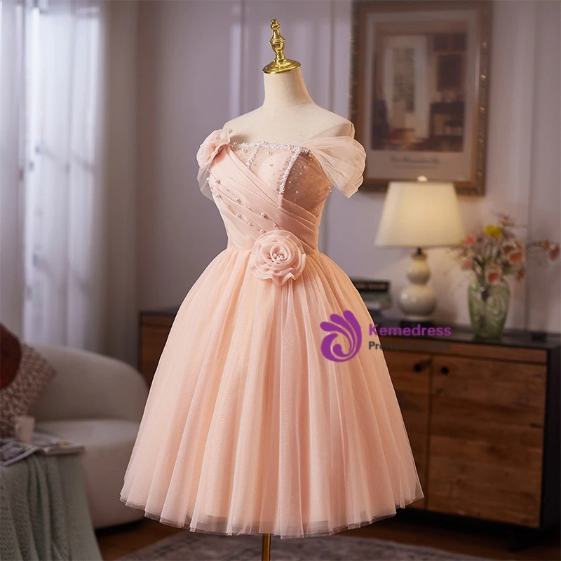 Back view of light pink tulle flower homecoming dress with lace up back