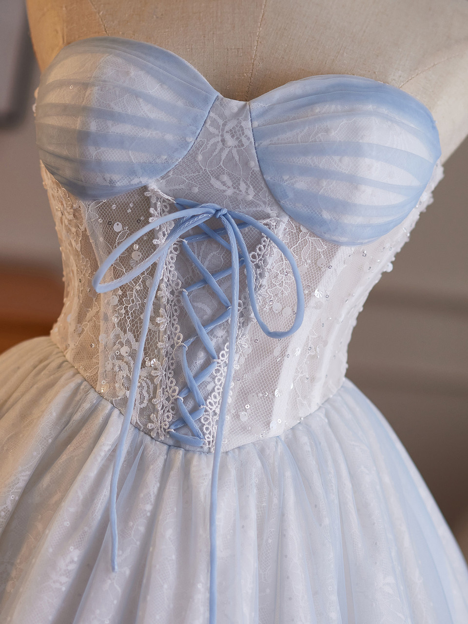 Light blue strapless lace corset homecoming dress with tulle skirt