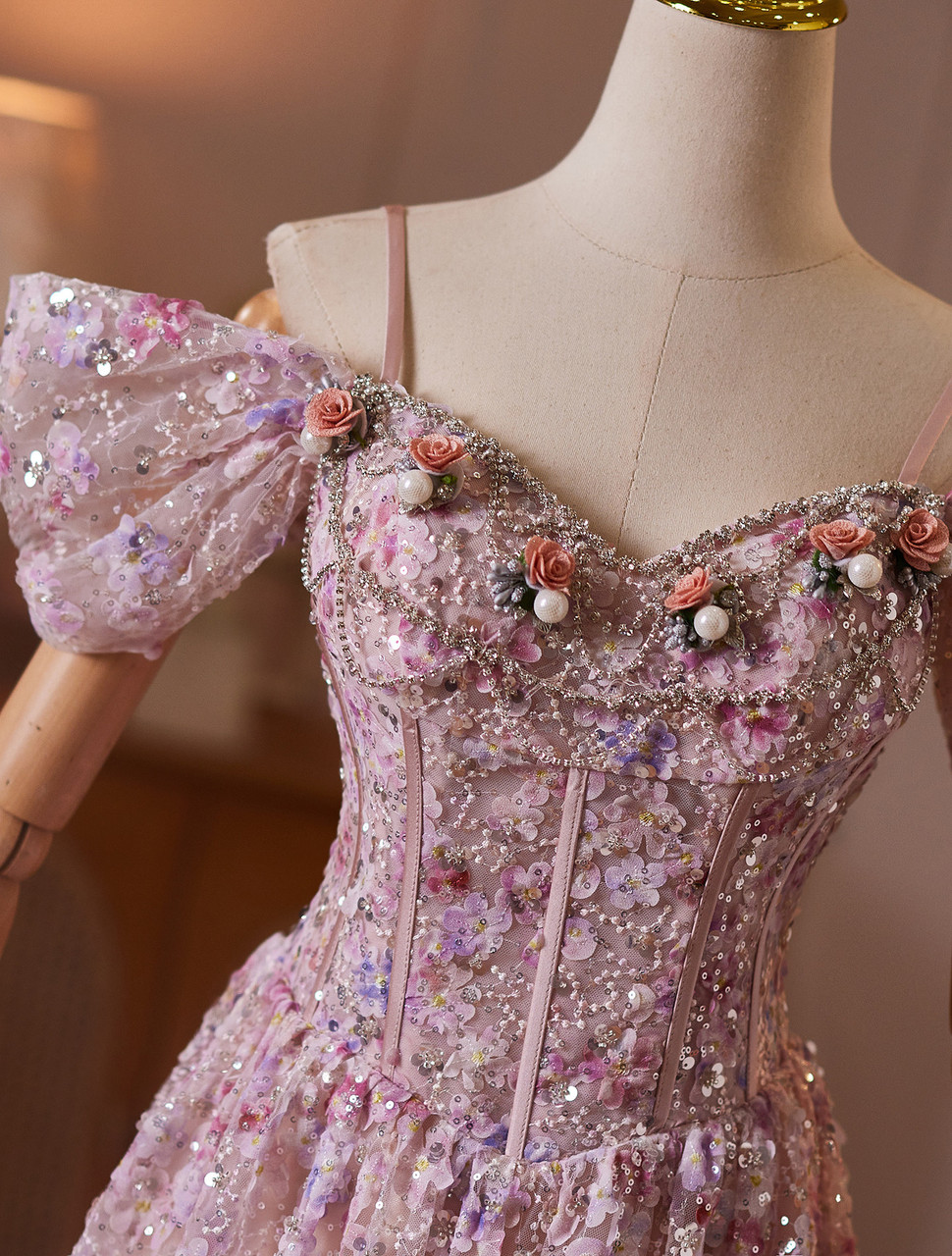 Pink embellished prom gown with floral sequins, pearl accents and off shoulder bow sleeves