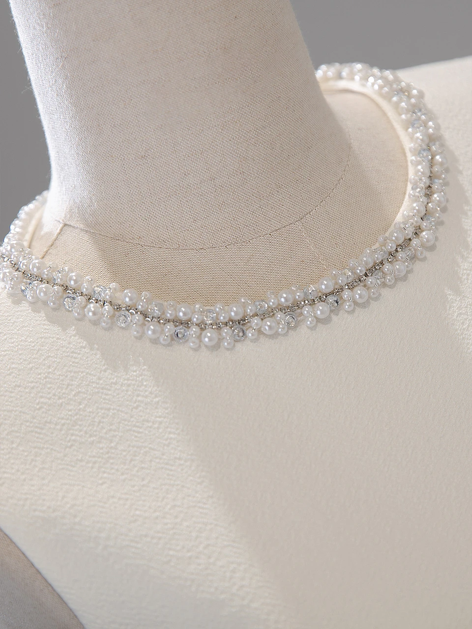 Back view of white scoop neck beaded ankle length wedding dress with zipper back