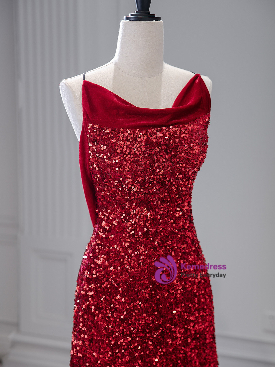 Close view of burgundy sequin gown with velvet cowl neckline and open back