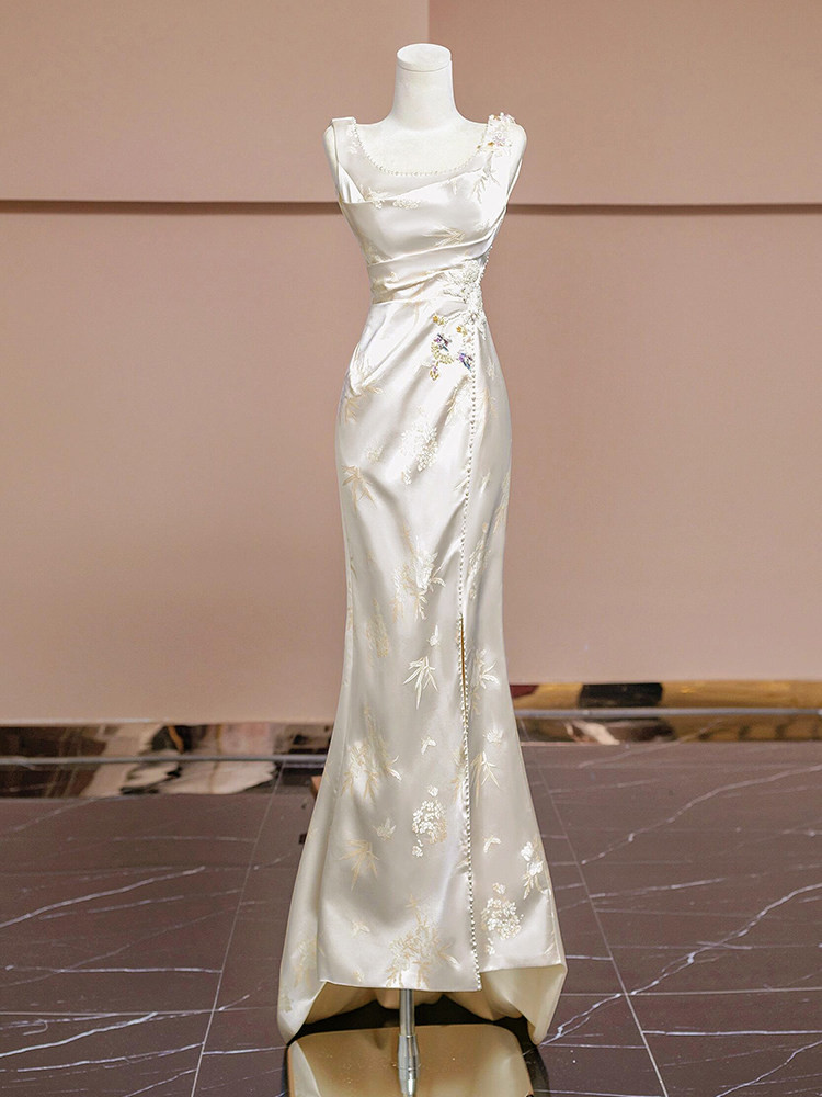 Champagne tulle wedding dress with colorful floral appliques and three quarter sleeves