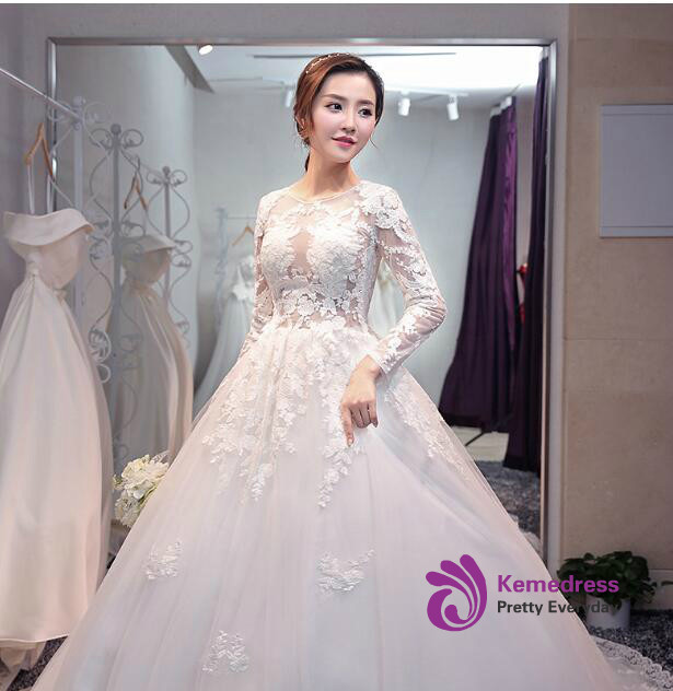 In stock long sleeve tulle lace wedding dress with floral lace appliques, illusion neckline, full ball gown skirt and scalloped lace train