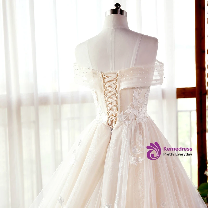 Champagne wedding dress bodice with floral appliques and off shoulder tulle detail