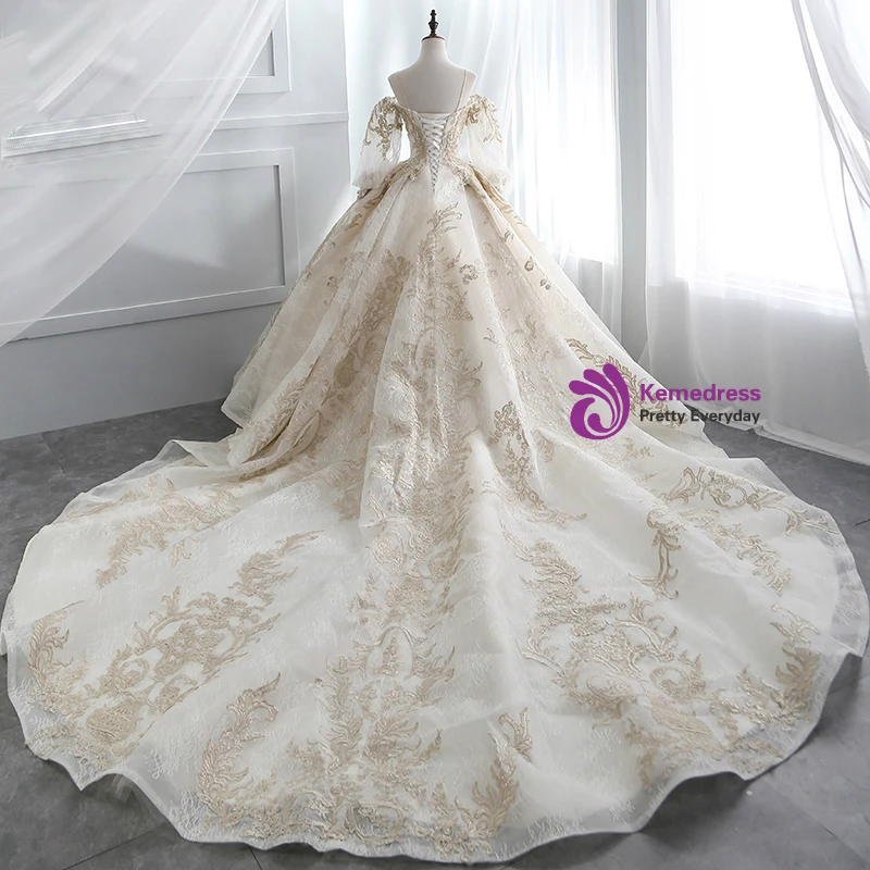 Champagne ball gown wedding dress with gold lace appliques, beading and long train