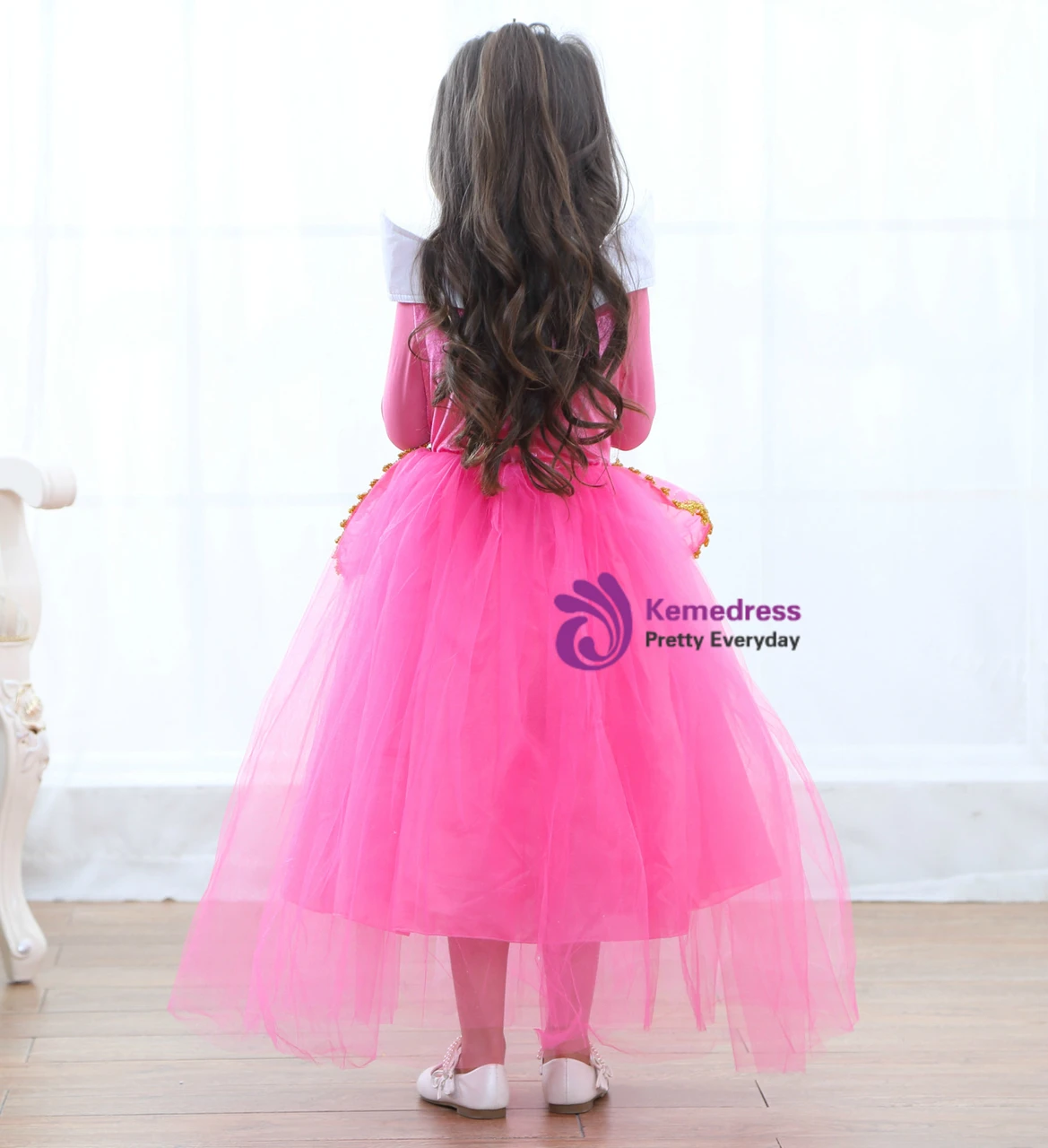 Pink long sleeve princess dress with full tulle skirt and sparkling appliqué details