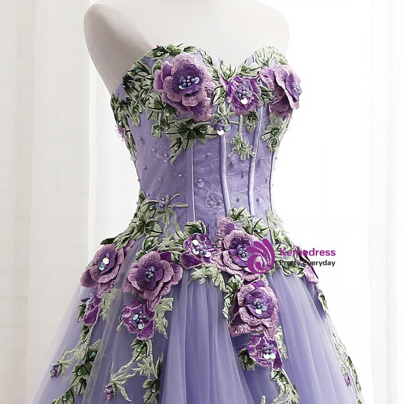 Close up detail of lavender lace bodice with three dimensional purple roses green embroidered leaves and rhinestone flower centers