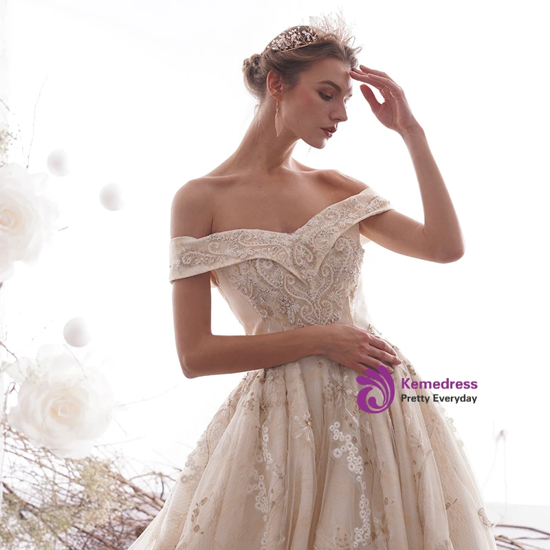 Champagne tulle off the shoulder wedding dress with floral lace appliques and cathedral train