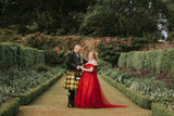My Scottish Handfasting Vow Renewal in a Red Off-Shoulder Wedding Dress