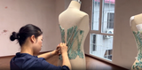 The Crystal Work Behind a Mint Green Ball Gown