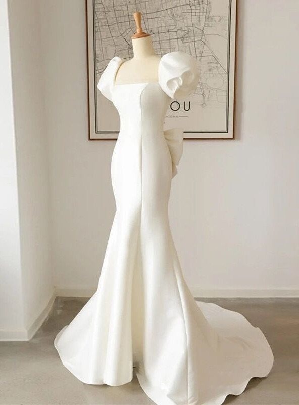 Ivory Dress with a Bow on the Back