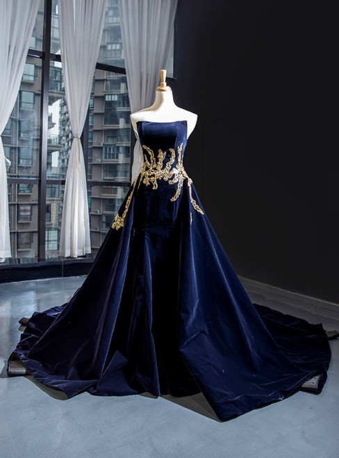 Navy blue velvet strapless ball gown with backless design and long train