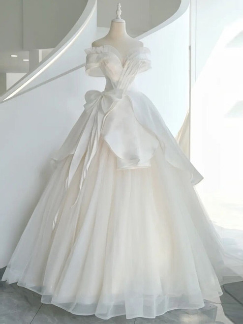 White tulle off-the-shoulder wedding dress with a beaded bodice