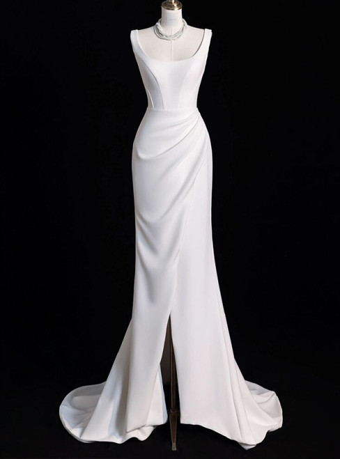 Modern mermaid satin wedding dress with a daring high slit and delicate pleated bodice.