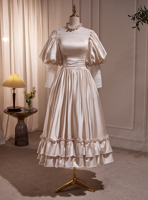 Champagne satin high neck wedding dress with long sleeves and tea-length A-line skirt