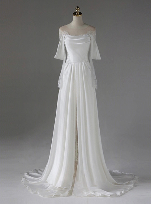 White satin A-line wedding dress with an off-shoulder lace bodice, a flowing floor-length skirt, and a subtle front slit.