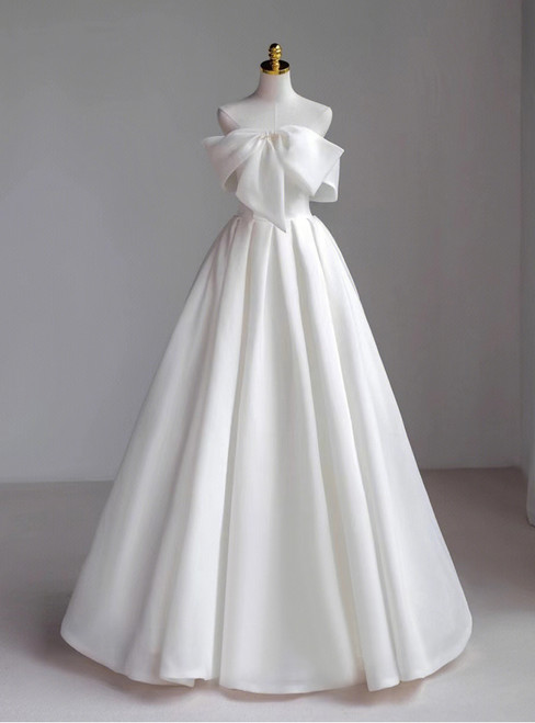 Stunning strapless A-line wedding dress with an oversized satin bow at the waist.
