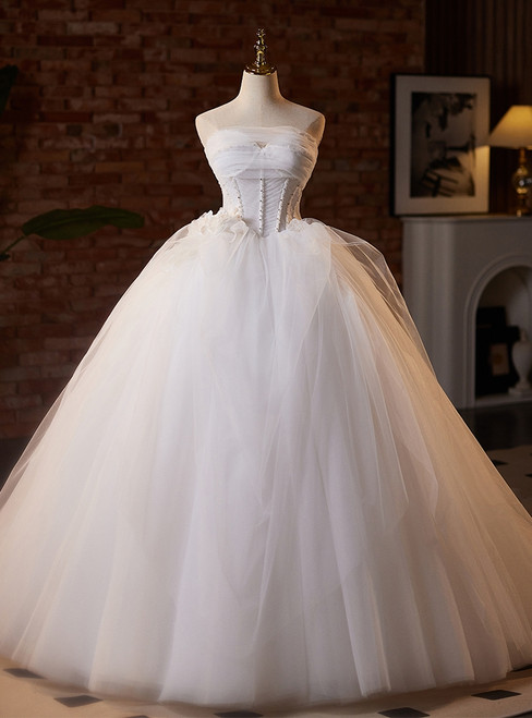 White tulle strapless wedding dress with delicate beadwork and floral appliqués, elegant bridal gown for ceremony