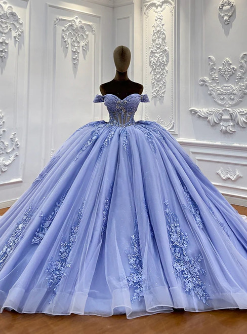 Vintage blue tulle ball gown wedding dress featuring an off-the-shoulder neckline and delicate lace appliques on a floor-length flowing skirt.