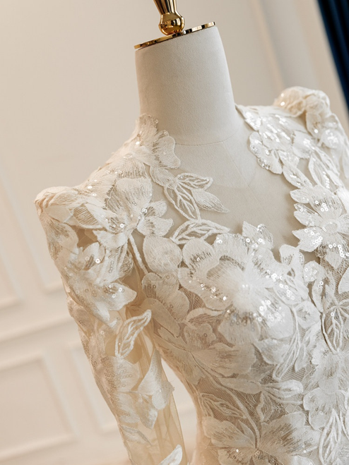 Close up of intricate lace texture on a mermaid wedding dress bodice