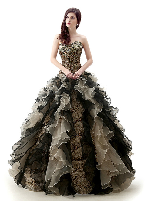 Leopard print Quinceañera ball gown with a crystal-beaded sweetheart neckline and full organza skirt, a bold choice for a modern celebration