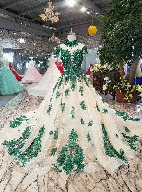 Champagne high neck ball gown wedding dress with green lace appliqués and cap sleeves