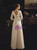 Backless wedding dress with dramatic satin bow and plunging V-back