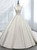 Elegant white satin ball gown wedding dress with a plunging V-neck and backless