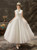 White satin ankle length wedding dress with lace appliques