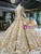 Lace-up back detail of gold beaded long sleeve ball gown wedding dress