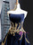 Luxurious velvet fabric on navy blue backless evening gown