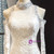 Ivory White Tulle Sequins Mermaid Long Sleeve Backless High Neck Wedding Dress