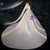  Lace-up back detail of an ivory satin wedding dress with a bow embellishment