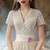 We Provide Champagne Tulle V-neck Short Sleeve Beading Pearls Wedding Dress