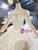 Check Out Entire Collection Tulle Sequins Long Sleeve Open Back Beading Wedding Dress