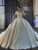 White satin ball gown wedding dress with long sleeves and beaded appliques
