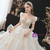 Romantic puff sleeve detail on champagne sequin wedding gown