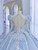 The breathtaking backless design of a blue ball gown wedding dress, where lace-up meets bare skin