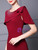 Close up of exquisite beaded neckline on a burgundy mother of the groom dress