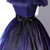 Sophisticated square neckline on a navy and purple tulle ball gown, framing the shoulders beautifully